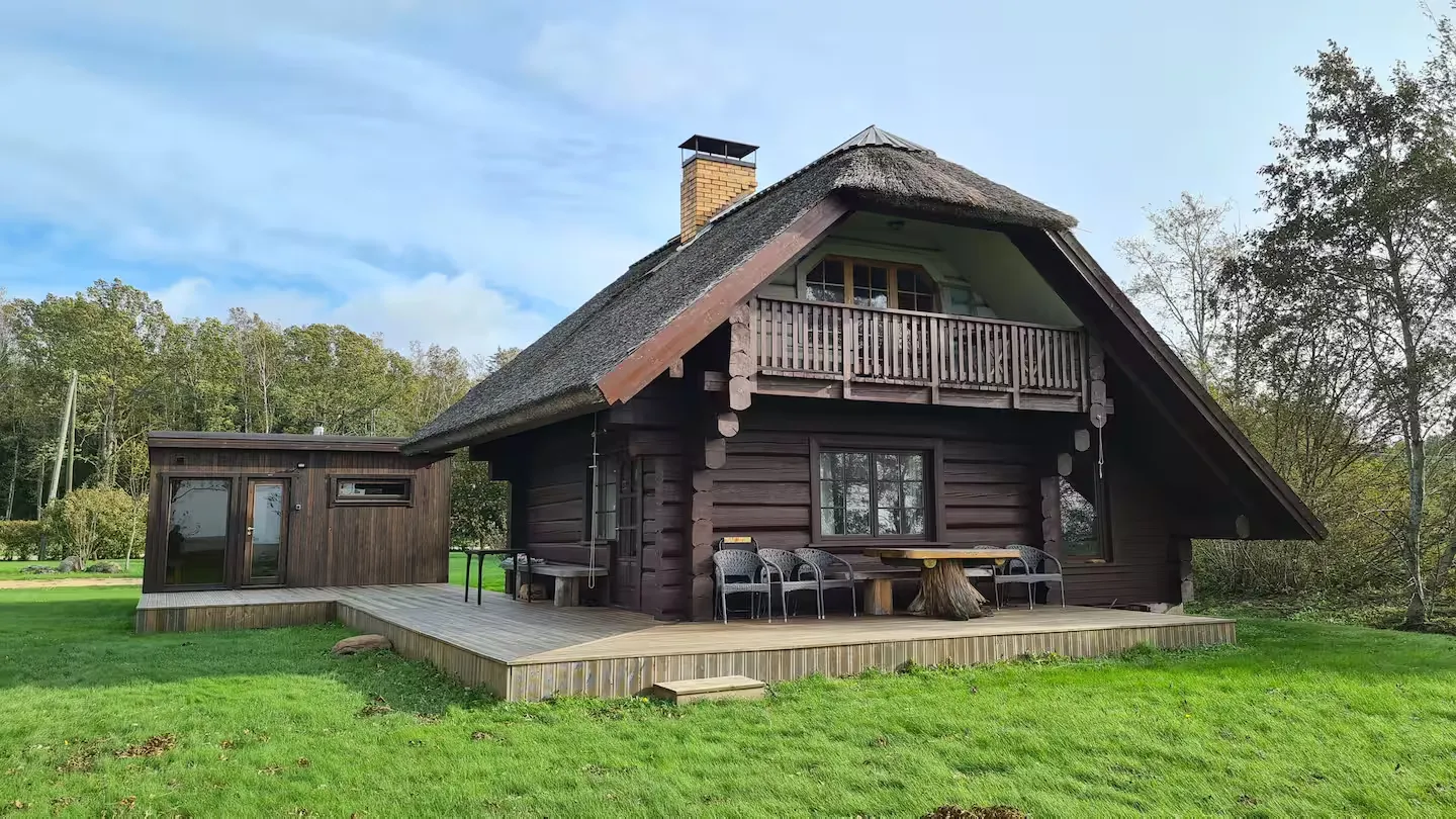 The log cottage in evening light